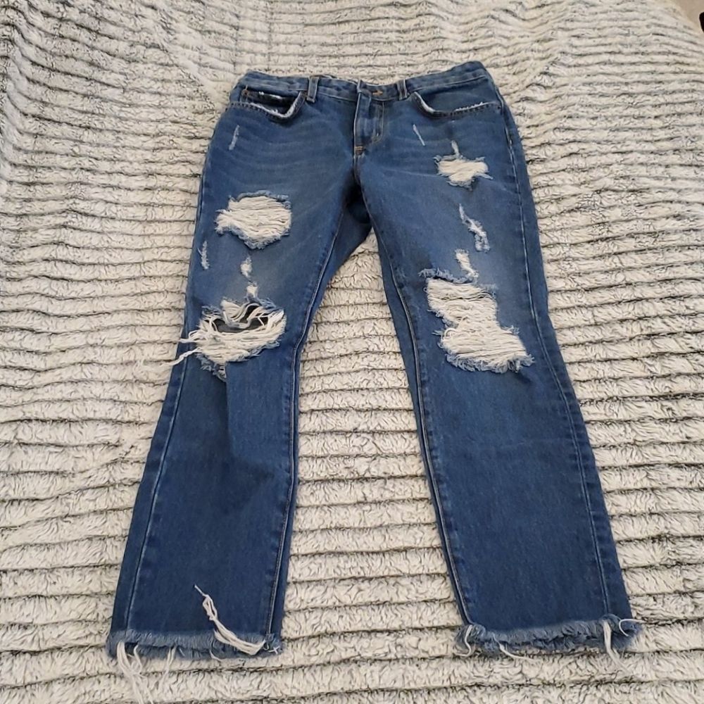 Overly distressed Carmar cropped jeans